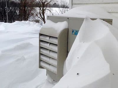 heat pump outdoor unit buried in snow