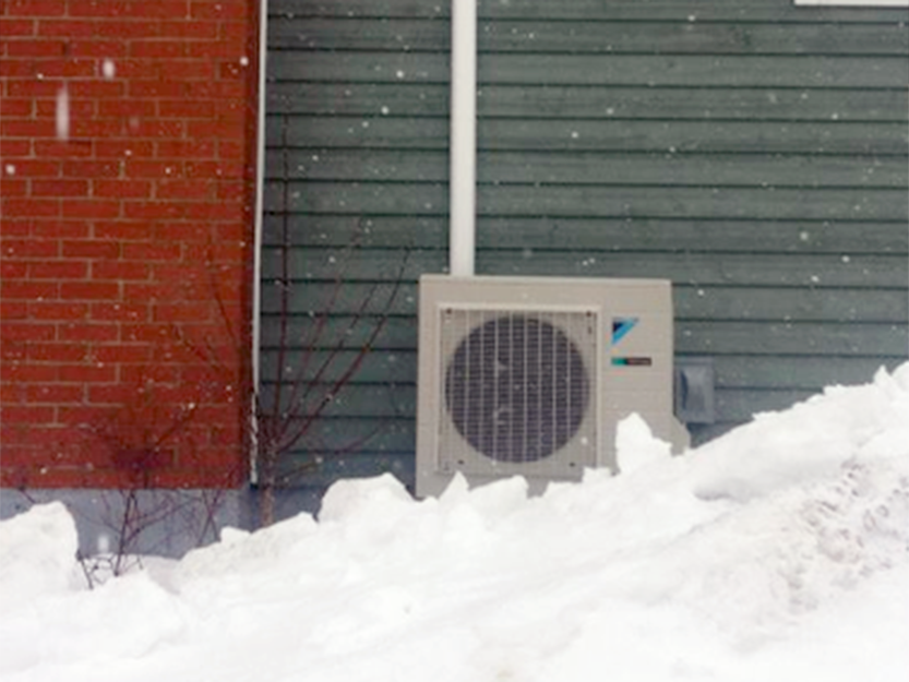 Daikin heat pump in snow
